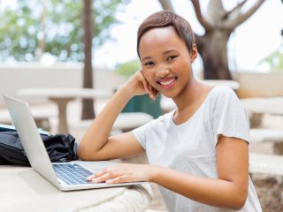 Smiling woman with laptop